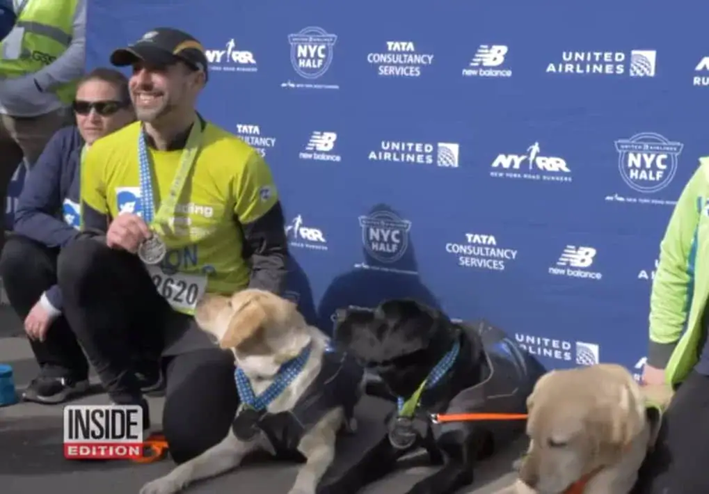 3 Labrador guide dogs help blind marathon runner make history