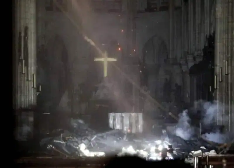 First look inside Notre Dame Cathedral reveals solitary cross standing amid the ruins