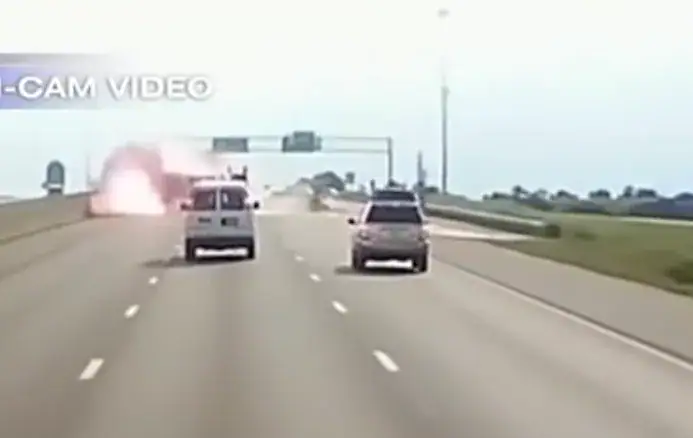 Trucker runs straight towards a fiery crash – dash cam captures moment he opens the car door