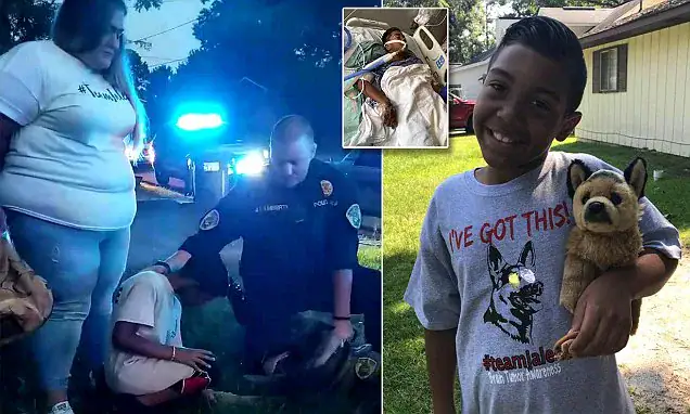 Police officer kneels to pray over 9-year-old boy with tumor just hours before his brain surgery