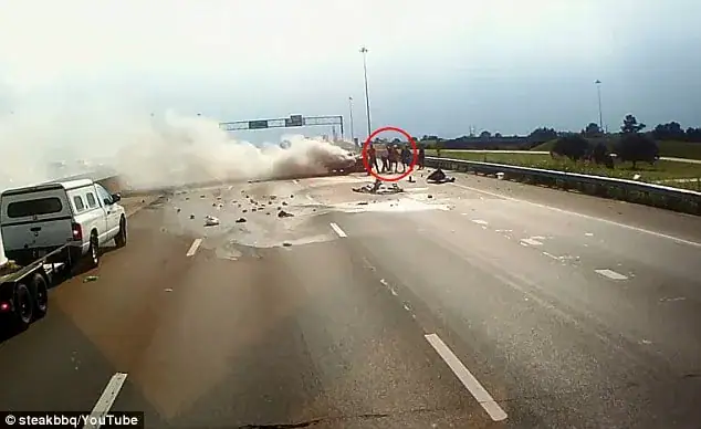 Trucker runs straight towards a fiery crash – dash cam captures moment he opens the car door