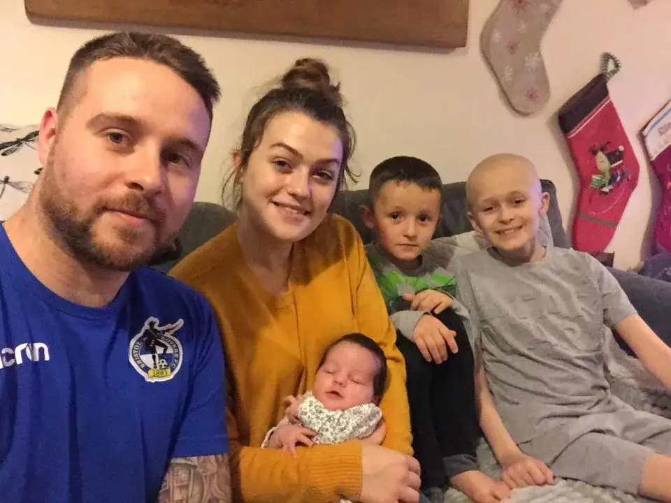 Boy with terminal cancer defies odds, hangs on to meet baby sister before dying on Christmas Eve