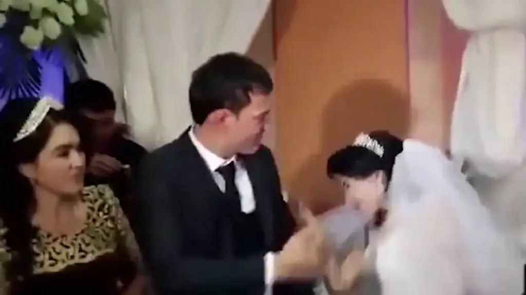 Husband viciously slaps his new bride on wedding day after she teases him with cake