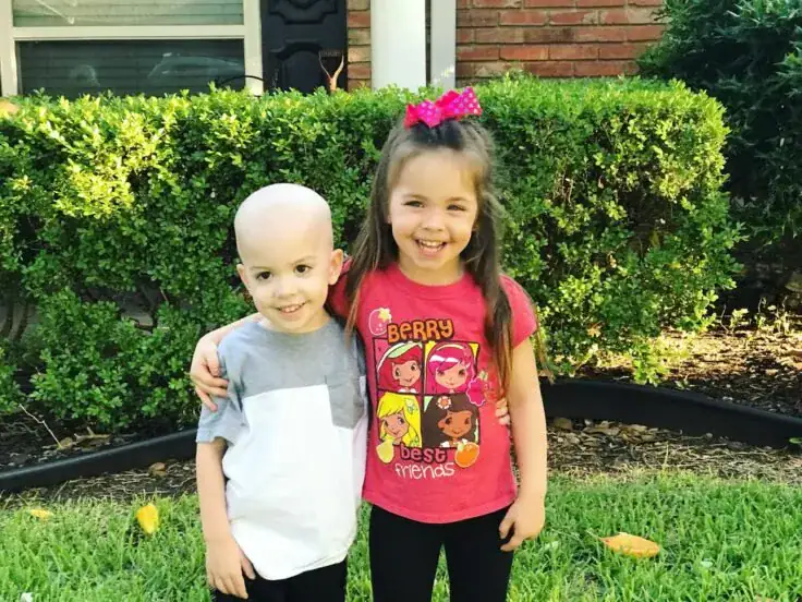 Sister comforts sick younger brother battling Leukemia in heartbreaking photo