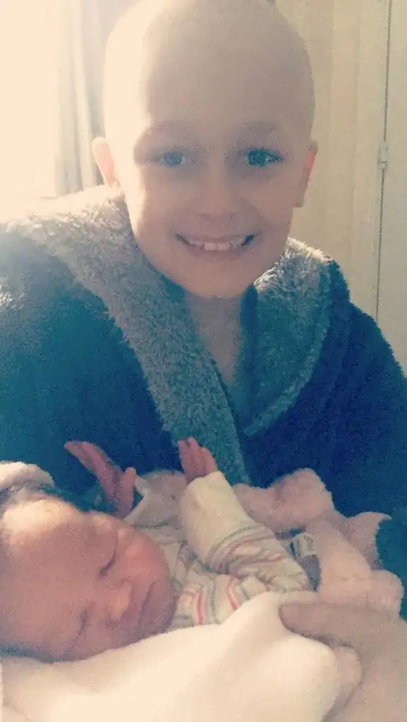 Boy with terminal cancer defies odds, hangs on to meet baby sister before dying on Christmas Eve
