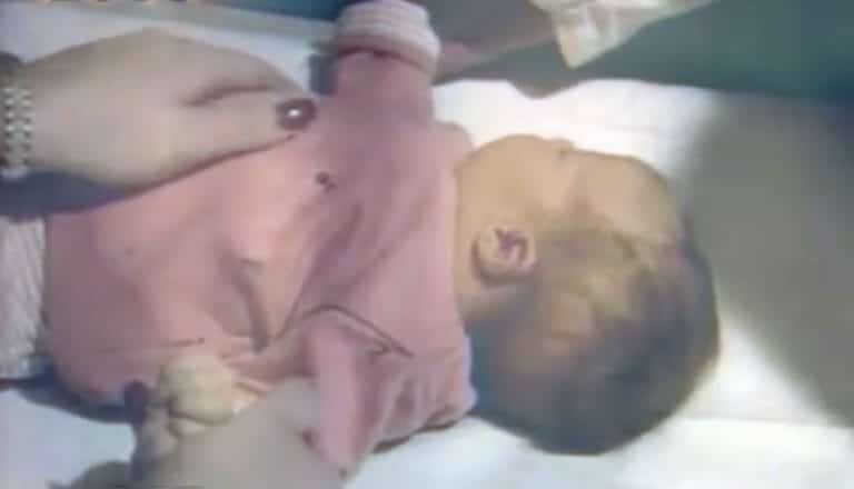 Mom hears kitty making strange noises over baby monitor, checks bedroom and leaps for the phone