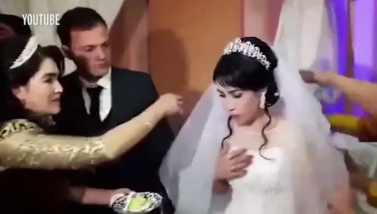 Husband viciously slaps his new bride on wedding day after she teases him with cake