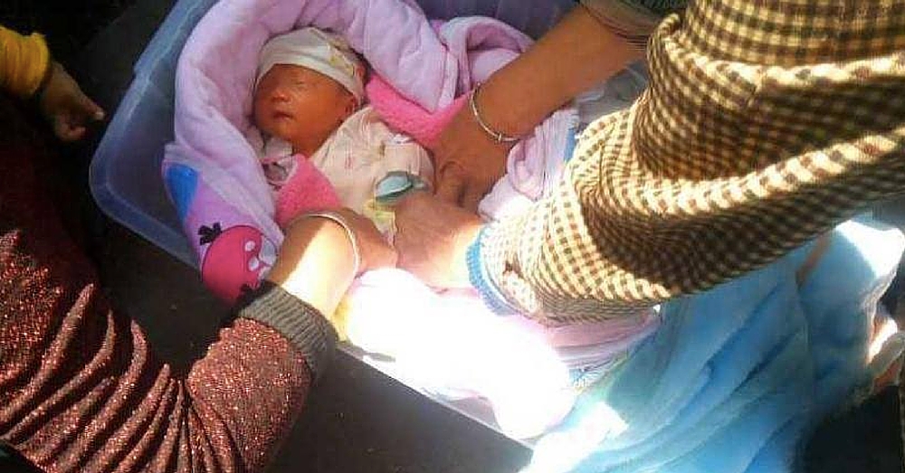 Woman Finds Crying Baby Abandoned In Plastic Bin, Then A Stranger Emerges From The Crowd