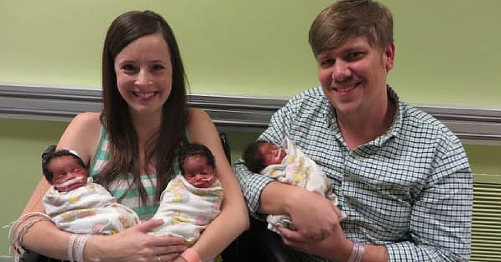 Parents Smile For Camera With Newborn Triplets. But Look Closely At The Babies’ Faces…