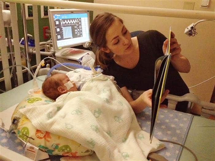 Demi Frandsen reading a book to Leo. Demi donated breast milk to honor her son. Courtesy of The Frandsen Family