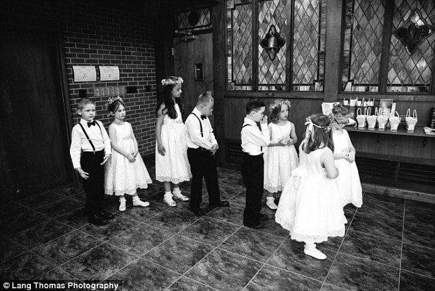 For the day: The kids served as flowers girls and ring bearers for the ceremony