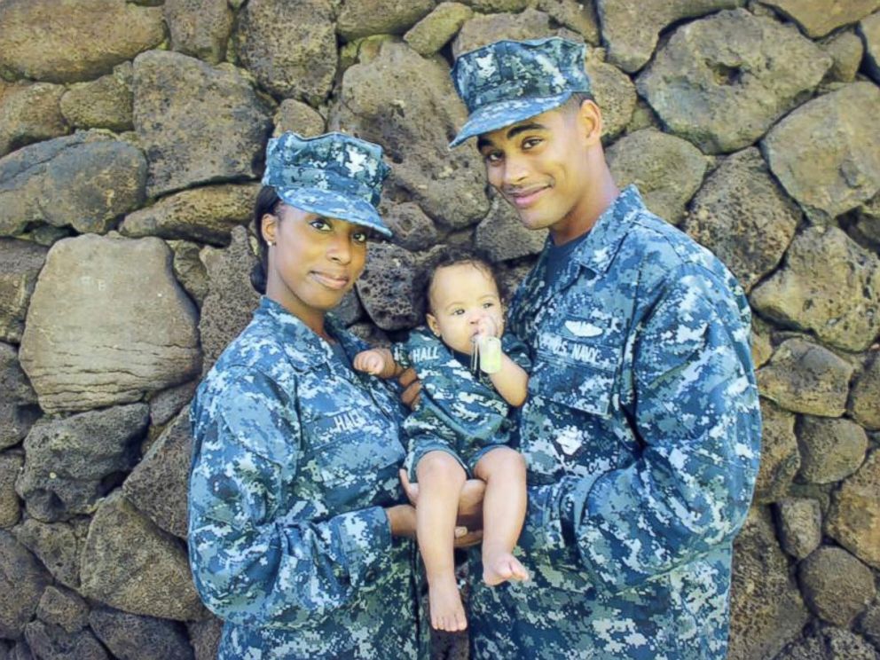 LeShaina Hall with her husband Lamarr, who is currently deployed in the Navy, with their 1-year-old daughter, Mia. Sara Rose Devlin/Compass Rose Photography