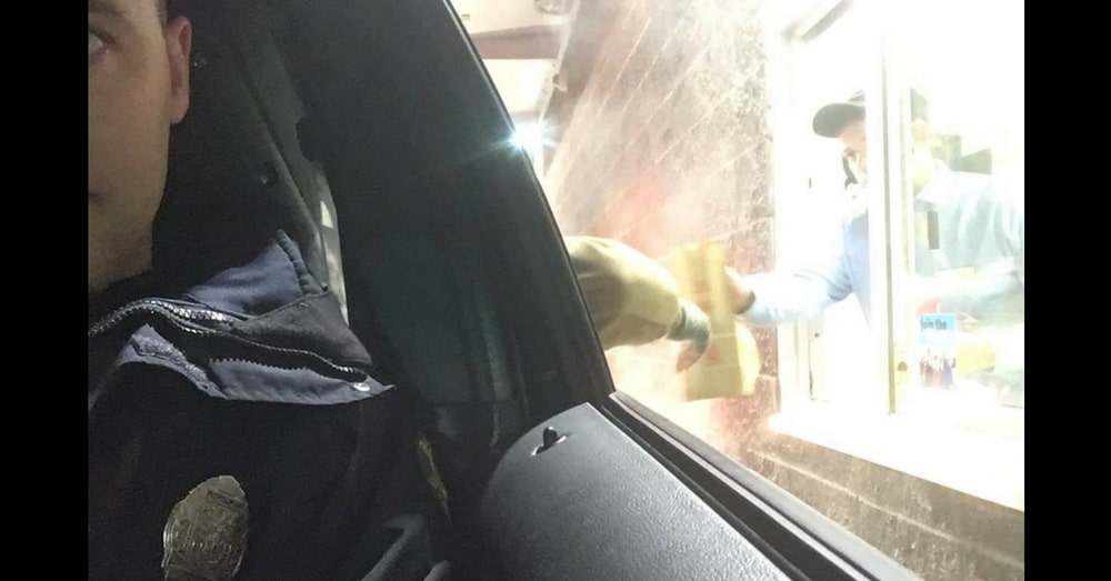 Cop Pulls Up To Drive-Thru Window, But Then A Hand Reaches Out From The Back Seat…