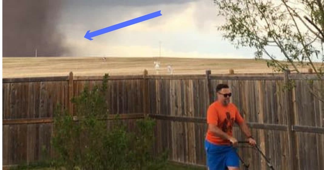 She Takes Pic Of Husband Mowing Lawn, But What’s Behind Him Has People Screaming
