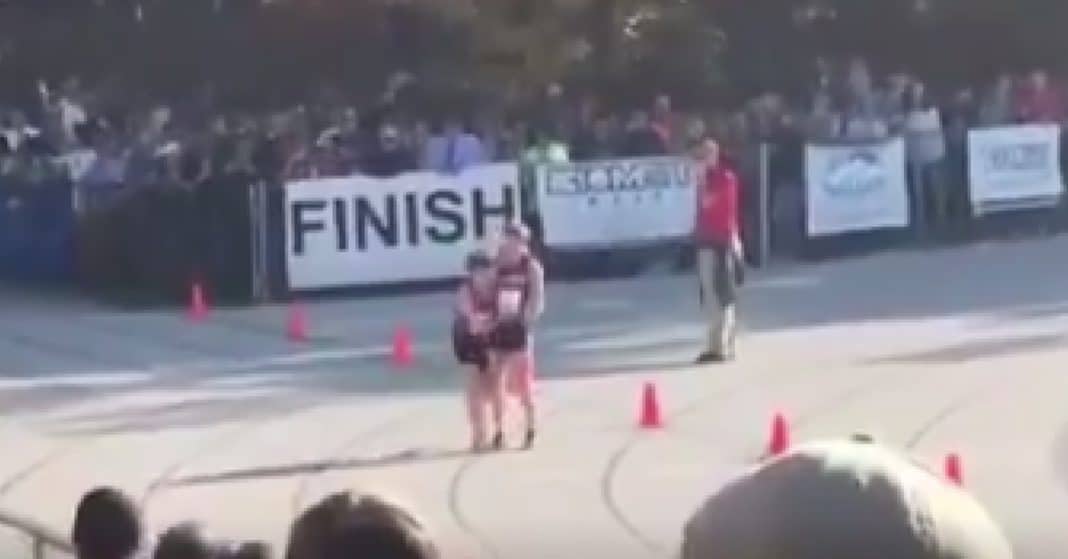 Runner Breaks Leg In Middle Of Race, Then ‘Angel’ Swoops In And Grabs His Arm