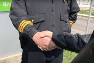 Police shake Bill's hand