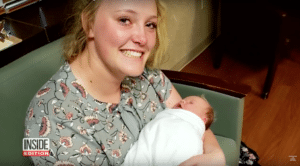 Morlie Hayes holds the baby she delivered