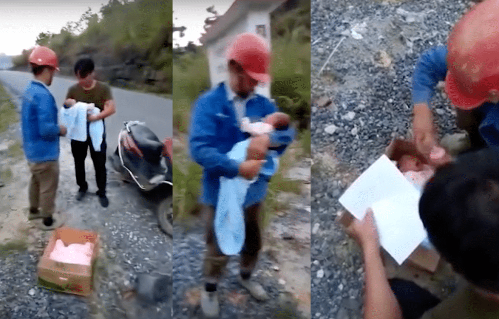 The men try to comfort the baby as they wait for police