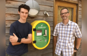 Stuart and Ethan Askew with the defibrillator