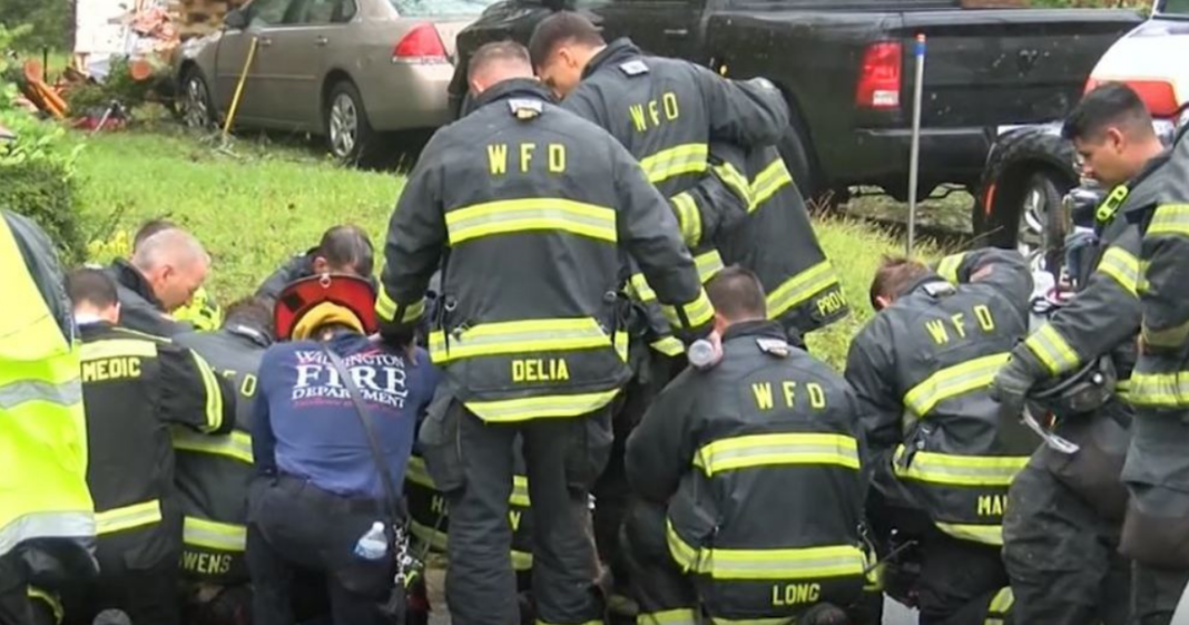 First Responders Stop To Pray Outside Home Of Mother And Baby Killed By Tropical Storm Florence