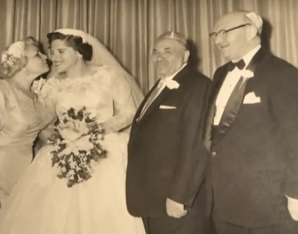 Joanne Lowenstern on her wedding day with the parents who adopted her