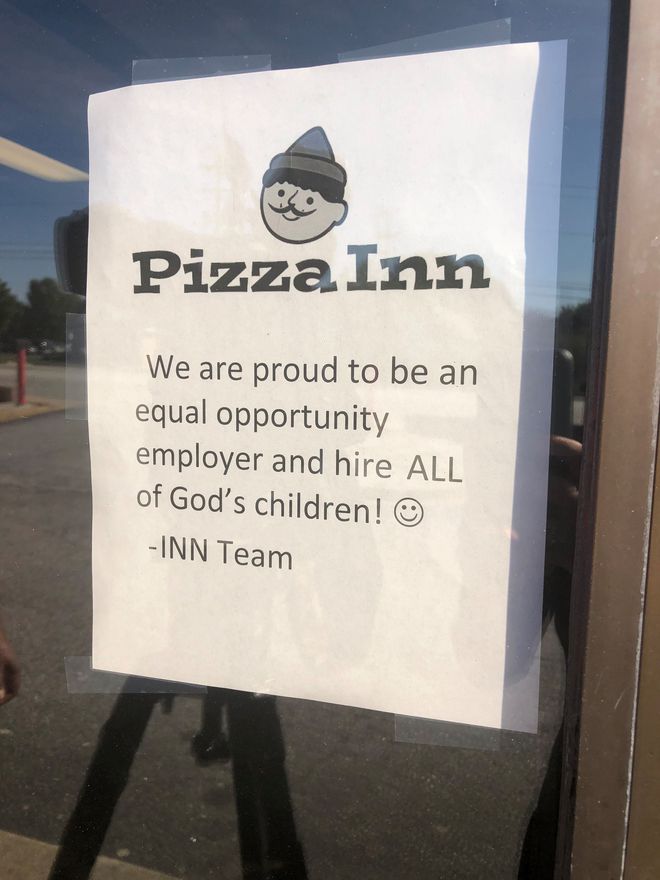 Sign in the window at Pizza Inn