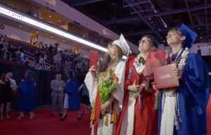 The Yeckes get their diploma and a standing ovation