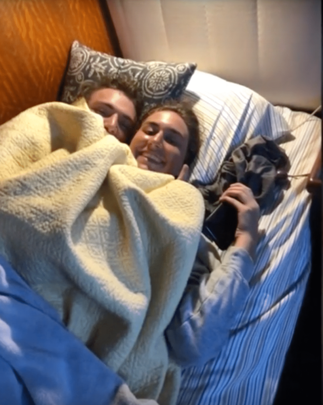 Heather Brown and Tyler Smith huddle under the blankets in the Amen