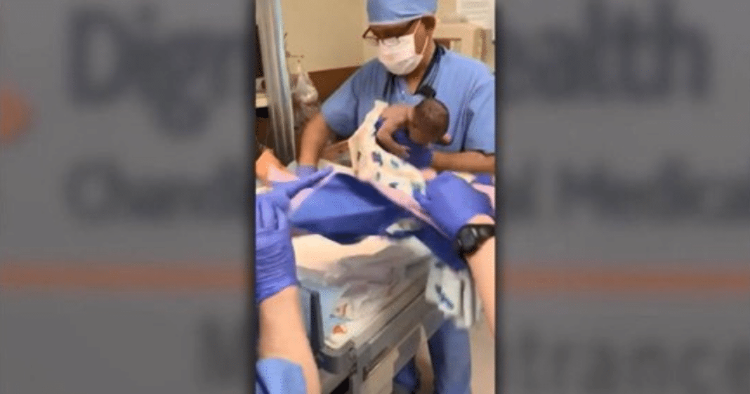 Family records birth when premature baby is suddenly dropped on her head in delivery room