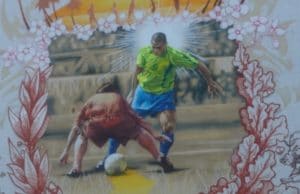 nutmegging mural showing soccer ball passing through other players legs